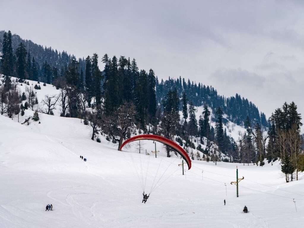 try paragliding in solang valley, enjoy the magical view of manali from the top